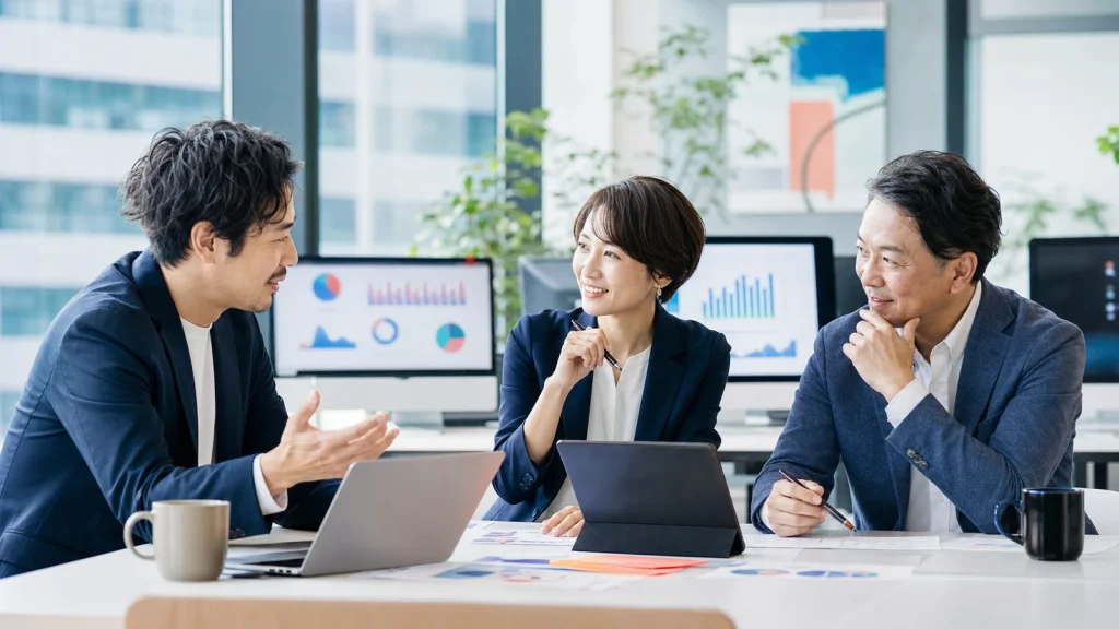 SNS運用代行会社 M&Aを検討する経営チームの相談風景